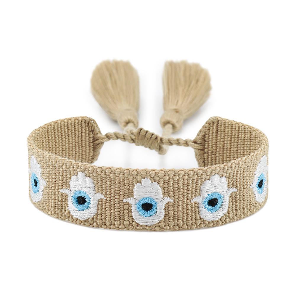 Blue-Eyed Lucky Charm Tassel Bracelet: Handmade European & American Style Woven Demon Eye for Women
