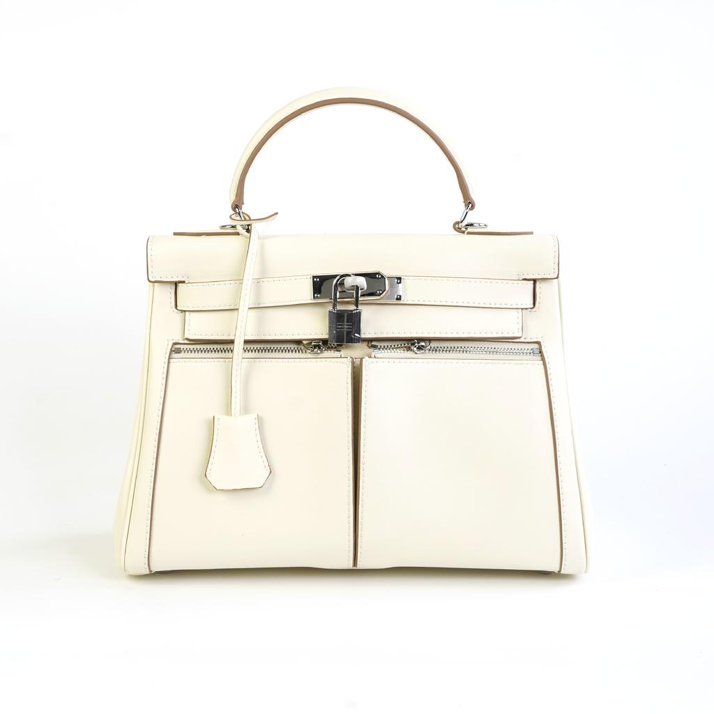 This Women's Bag Is Made of Cowhide with Double Pockets and Has a Large Capacity for Commuting. It Features Two Shoulder Straps and a Shoulder Strap