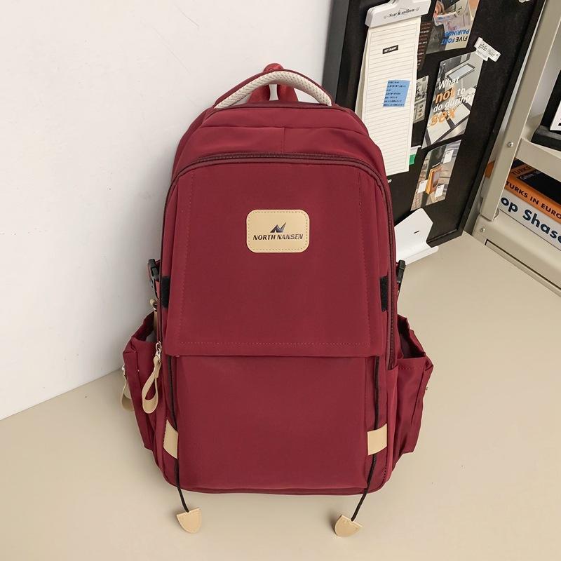 Neuer Rucksack weiblich Mittelschule College-Student Schultasche einfarbig beliebt Rucksack mit großem Fassungsvermögen einfacher modischer Stil