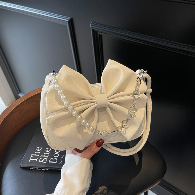 

Korean version of casual underarm bag women s 2025 new simple girly bow small square bag versatile crossbody bag