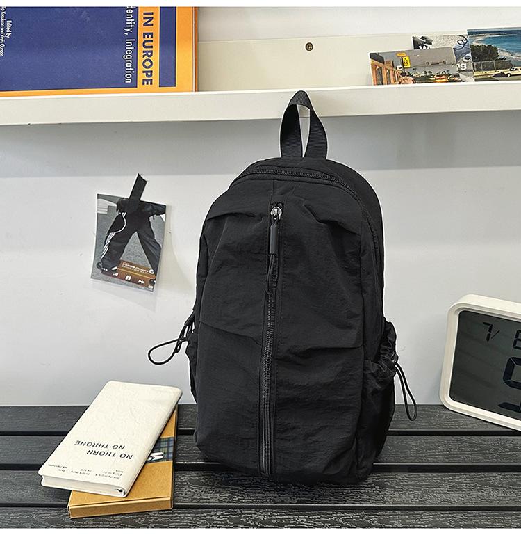 School bag Solid color outdoor mountaineering waterproof pleated backpack Lightweight leisure travel messenger bag Niche versatile simple breast bag