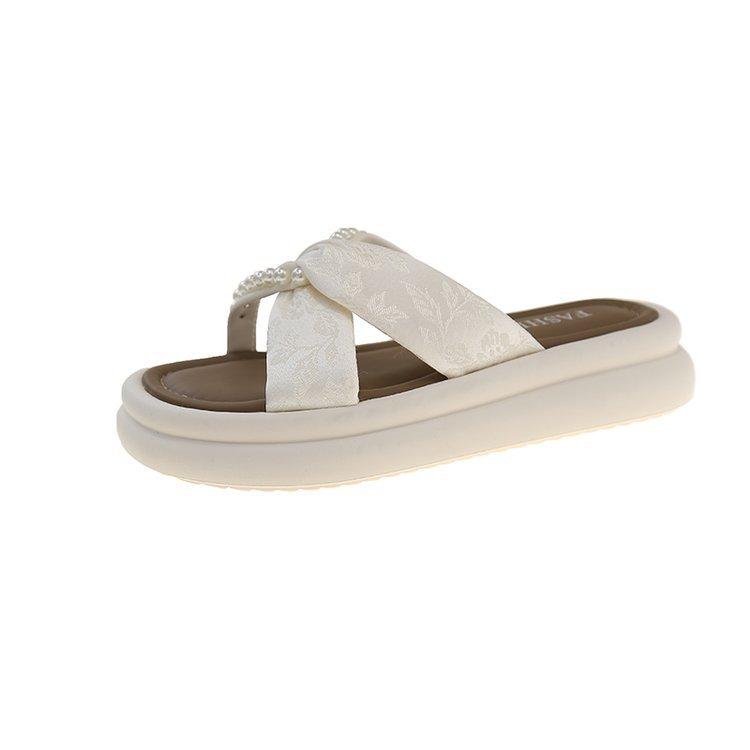 Thick bottom heightening outer wear one-word slippers female 2025 summer new fairy wind French beach pearl cool slippers