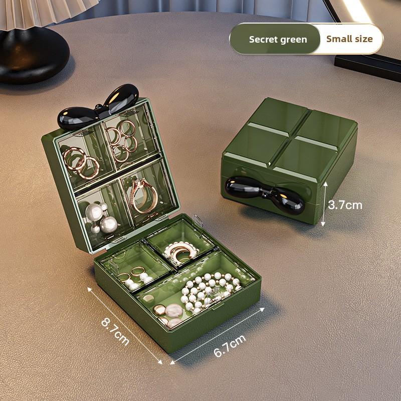 

Small portable travel jewelry box, exquisite new model for storing earrings, necklaces, rings, and other accessories with compartments Small size зелений
