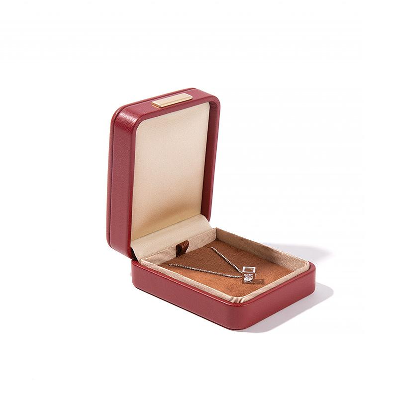 Högkvalitativ PU-läder Rundade Hörn Gyllene Spänne Smyckeskrin Ring Hänge Halsband Armband Förpackning Display Förvaringslåda