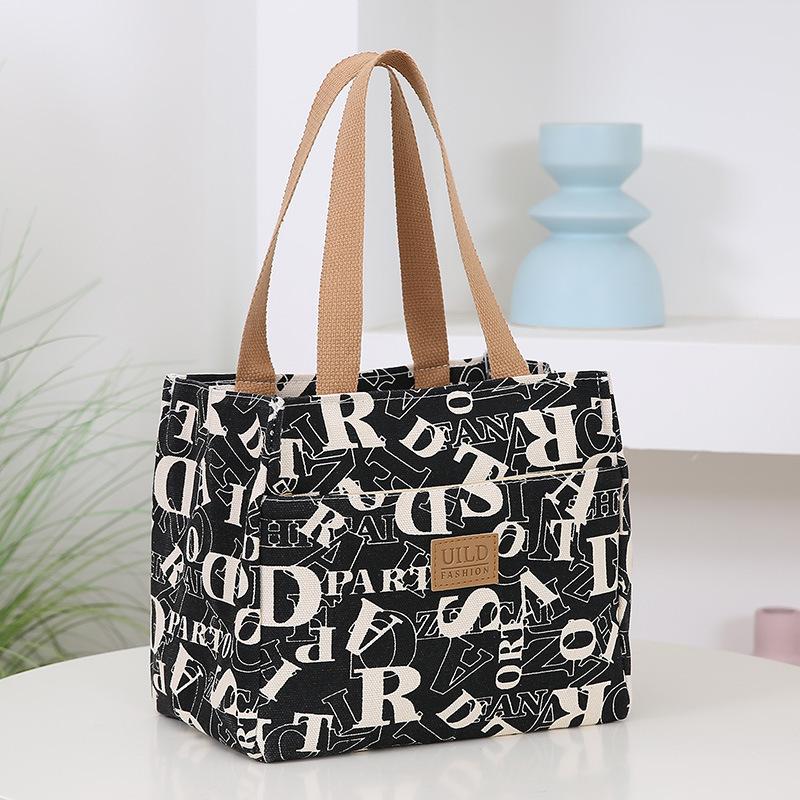 New canvas fashionable and lightweight handbag, hand carry to go to work, bring rice, lunch bag, aluminum foil insulation layer, lunch box bag