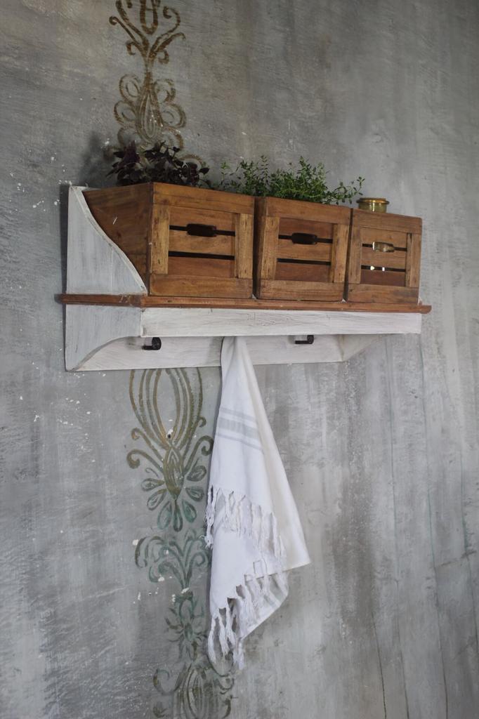Vintage style wall shelf with wooden baskets