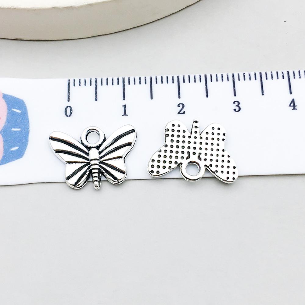 Set di 100 Ciondoli Gatto Farfalla Luna Argento Antico per Braccialetti e Collane Fai da Te
