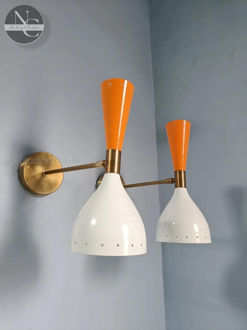 

Mid Century Brass Diabolo Wall Sconce Pair: Italian Stilnovo Style помаранчевий