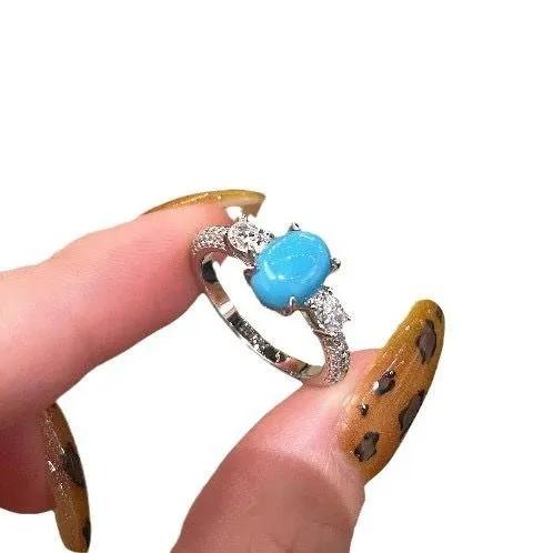 

Sterling Silver Ring with Oval Cabochon Stone and Clear Accent Stones Adjustable Band Fine Jewelry One Size синий