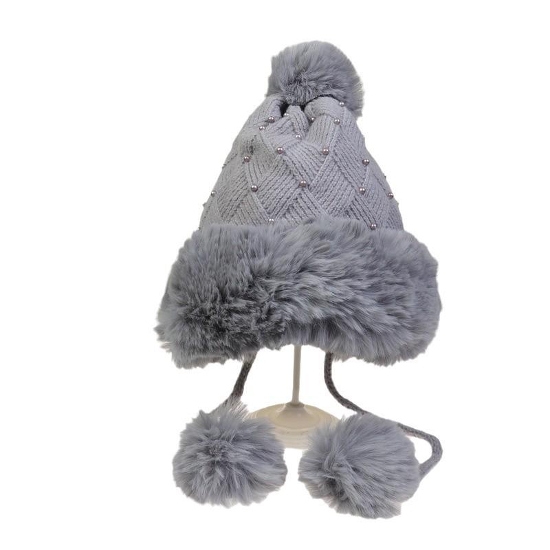 Winter Women's Knitted Hat with Beads and Fur Pom, Featuring a Velvet Lining, Large Fur Brim, and Warm Ear Protection.