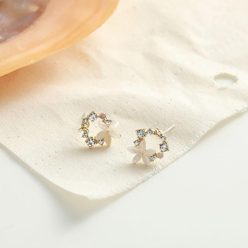 Boucles d'oreilles pendantes élégantes 2025 avec fleur en zircon œil-de-chat français et aiguilles en argent 925