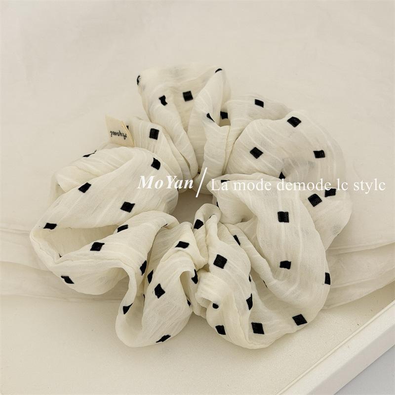 

Gebi Fabric Belt Hair Clip with A Sophisticated and Sweet Style Hair Tie for A Ponytail with A Flower At The Top.