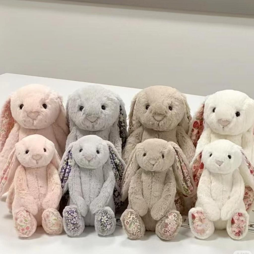 Floral Bunny Doll In White, Deep Pink, Light Pink, Brown, Grey, and Purple by Jellycat