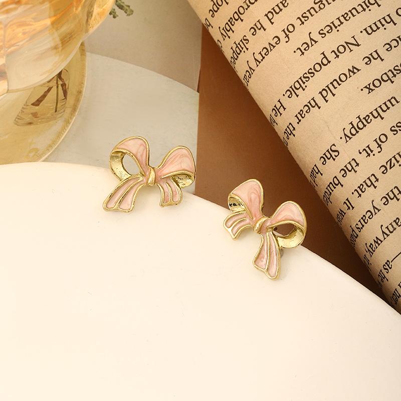 

Silver needle stud earrings, premium earrings, pink bow, new simple earrings, niche design, small earrings. рожевий