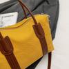 Classic Canvas Duffel Bag with Leather Trim and Adjustable Strap Perfect for Travel and Everyday Use