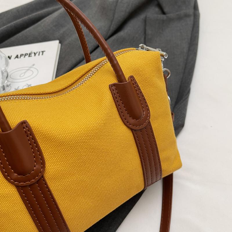 Classic Canvas Duffel Bag with Leather Trim and Adjustable Strap Perfect for Travel and Everyday Use
