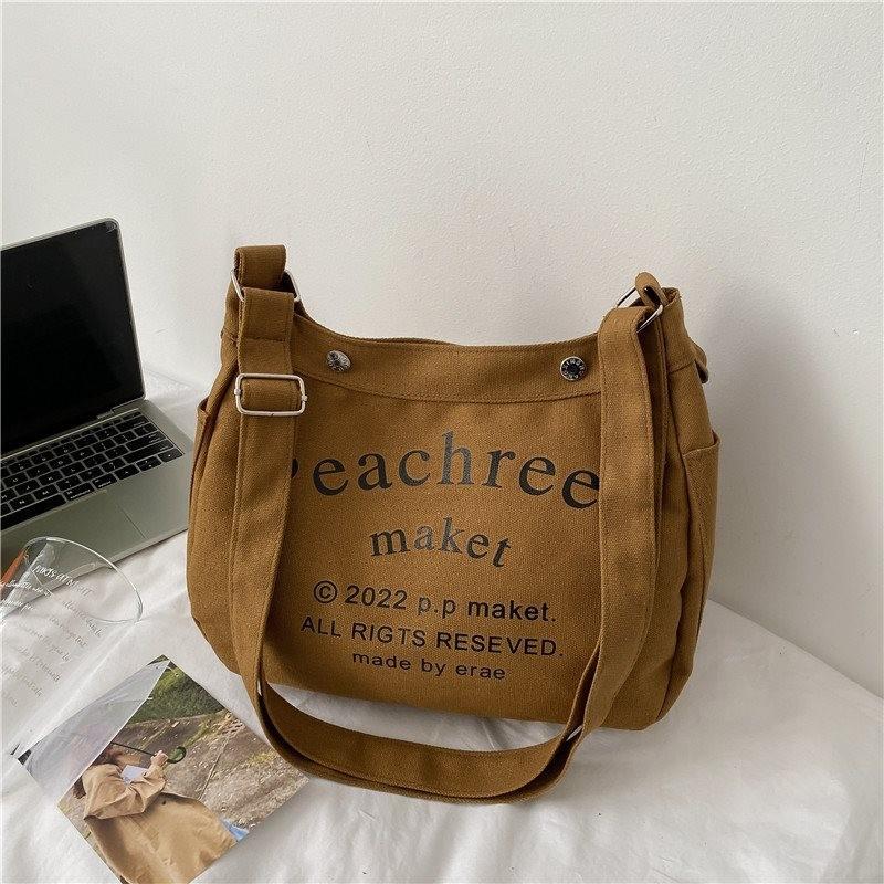 Stylish Korean Vintage Canvas Tote Bag For Women With Spacious Capacity And Trendy Lettering In Cream Brown Or Black