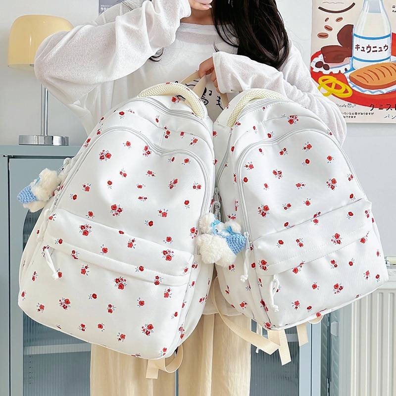 The new schoolbag is high-value, fresh and sweet floral backpack, and the lightweight spring outing backpack for junior high school students.