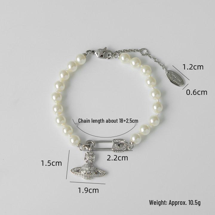 

Винтажный классический жемчужный чокер с брошью в виде Сатурна и бриллианта