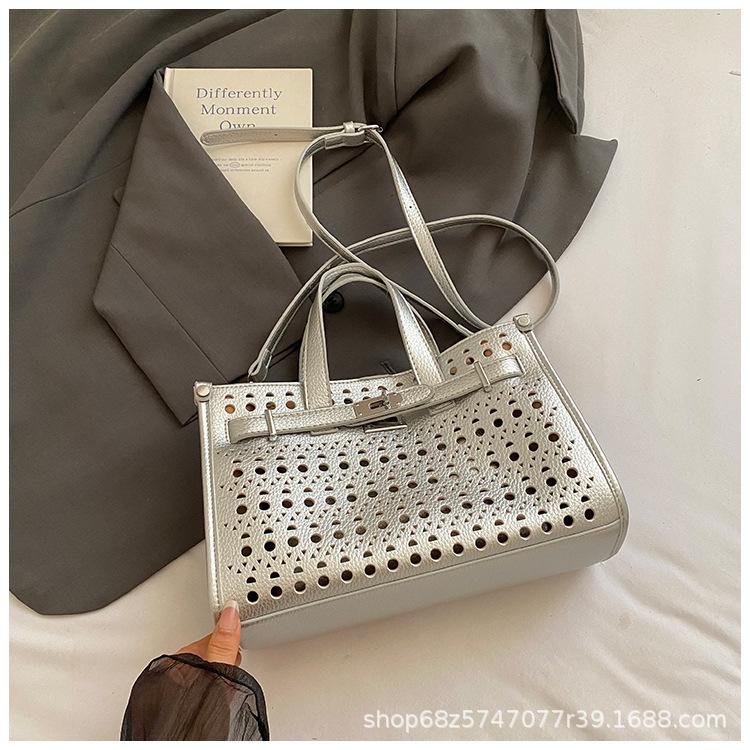 High-end cut-out handheld tote bag for women 2025 new fashion design large-capacity commuter mother-in-law bag crossbody bag