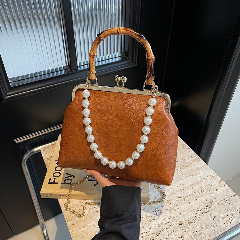 Spring and summer retro small bag women's new fashion bamboo joint portable mouth gold bag pearl chain messenger bag