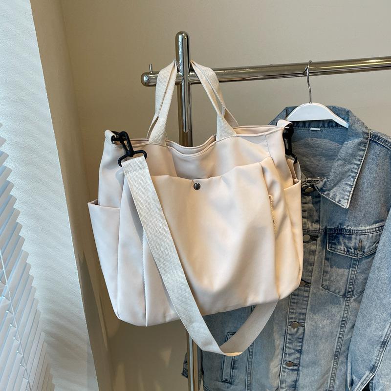 Simple commuter canvas bag Casual women's tote bag Portable multi-functional women's cloth bag Fashion cloth bag Large capacity