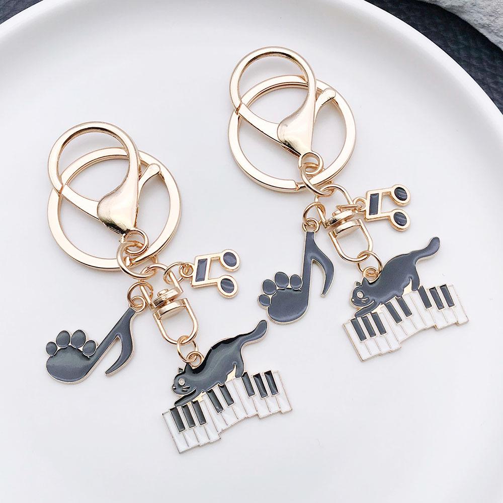 Well-Behaved Black Cat Zinc Alloy Keychain: Cute Drip Oil Cartoon Pendant for Backpacks
