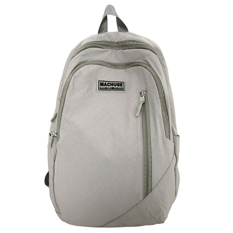 

Легкий нейлоновый универсальный дорожный рюкзак - Большая вместимость, мягкая поверхность, повседневный стиль для учеников средней и старшей школы серый