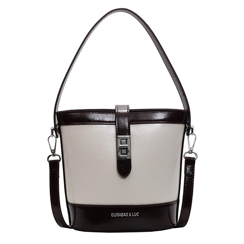 

Popular casual retro style contrasting color hand carry bucket bag versatile commuter advanced sense oil wax leather messenger bag female