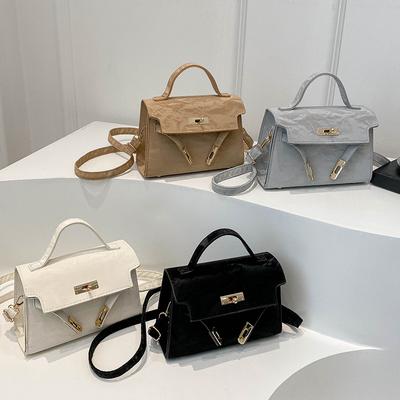 Bolso de mano de color liso con textura sencilla, diseño de nicho para primavera y verano, versátil, bandolera de hombro.