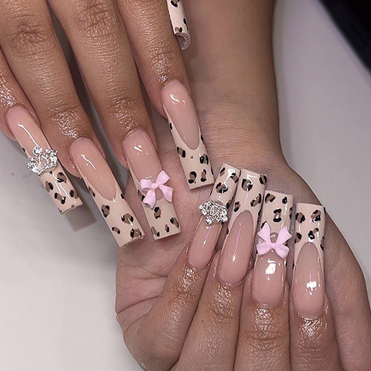 

Leopard Print French Tip Coffin Nails with Bow and Crown Accents