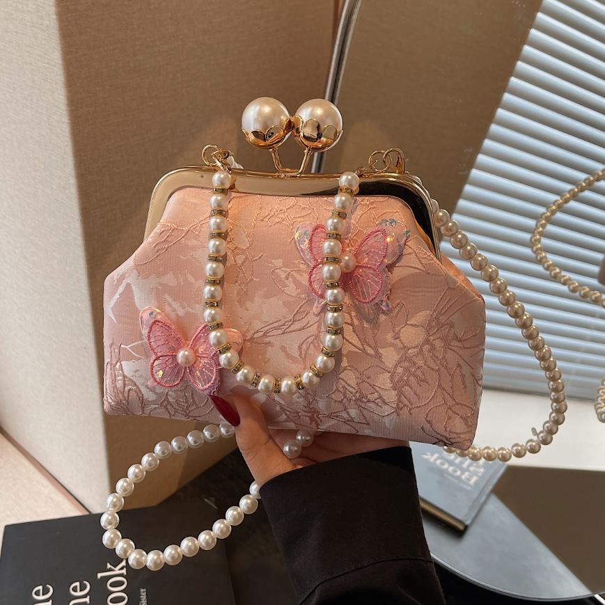 

Жемчужная сумка-клатч на цепочке, летняя мода, клипса-бант, женская сумка, нишевый дизайн, универсальная женская сумка через плечо/мессенджер розовый
