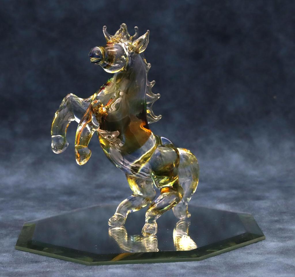 Glass Square Good Luck Charm: A Large, Standing Glass Horse Symbolizing Vitality, Drive, and Energy To Enhance Success. Available In Three Colors, 15c