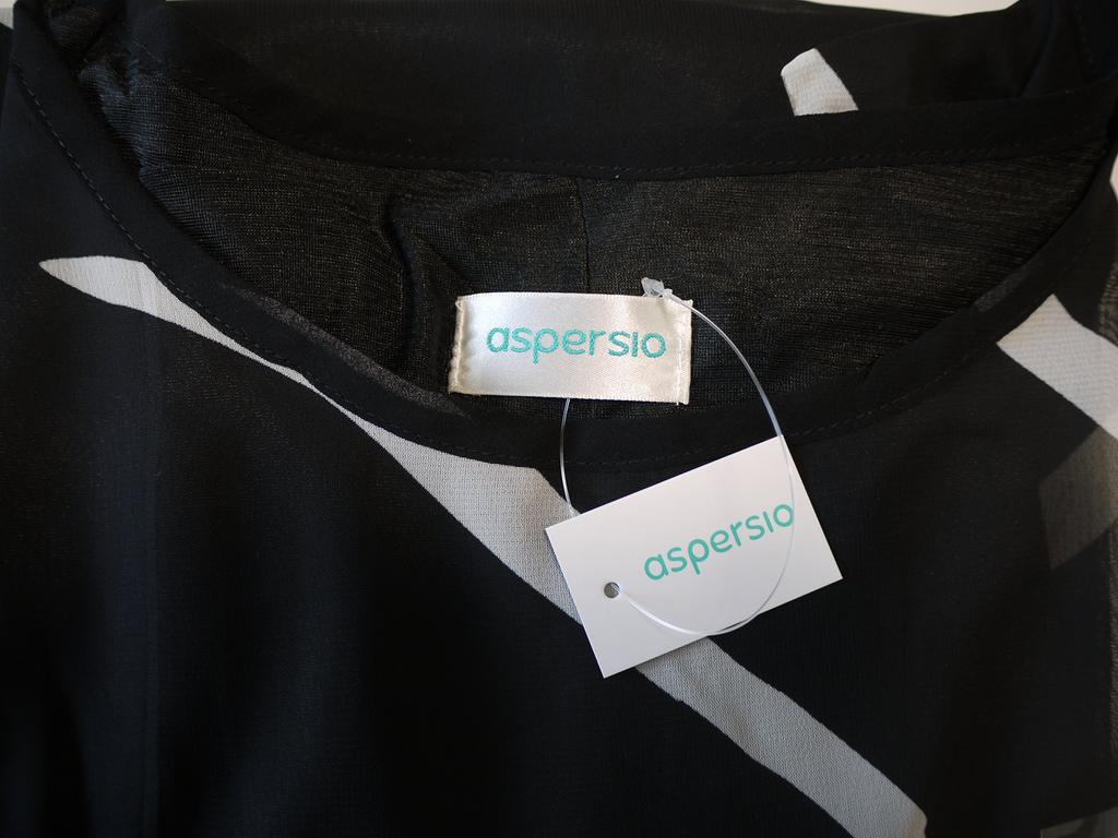 Aspersio Chiffon-Top mit einem schönen ausgestellten und Dieses figurschmeichelnde Überzieh-Shirt verfügt über ein und niedlich Es hat einen runden Tropfenausschnitt und ein Erhältlich in Schwarz