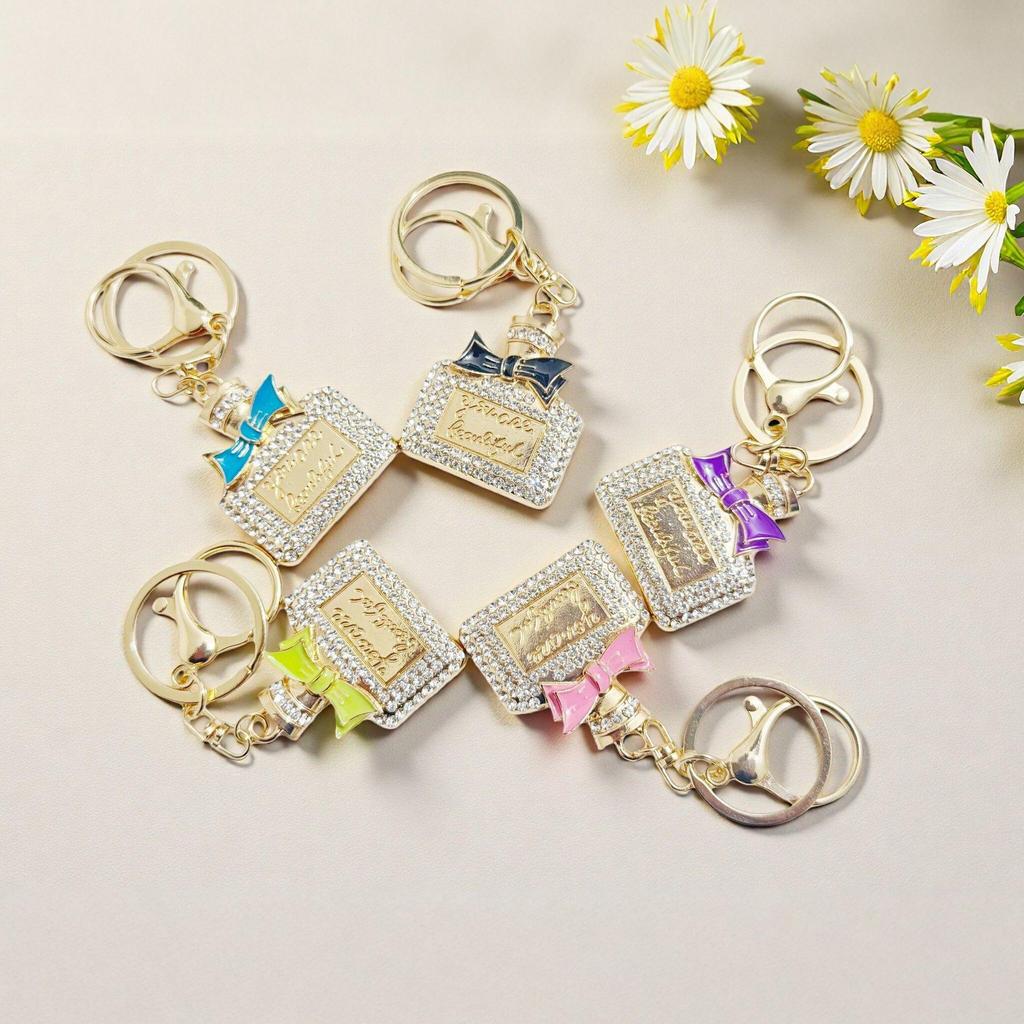 Radiant Bow Perfume Bottle Keychain & Elegant Bag Pendant Gift