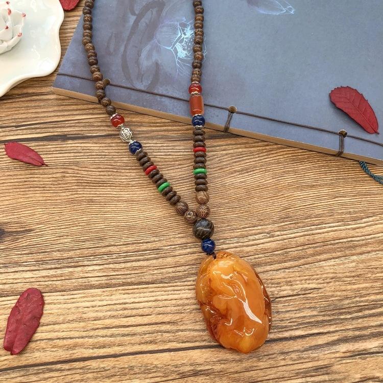 Retro chicken wing wood second generation old beeswax necklace men and women versatile amber pendant long sweater chain pendant
