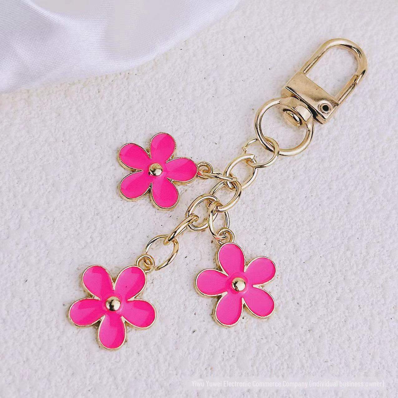 

Европейский и американский летний брелок с цветком цвета капли масла для мобильных телефонов, сумок и автомобилей. Each style individually packed