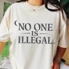 Maglietta Nessuno è Illegale | Giustizia Migratoria, Design Gotico Witchy, Diritti Umani, Abbigliamento Progressista