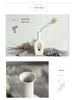 White Ceramic Vase with Dried Baby's Breath for Living Room or Dining Table Decoration