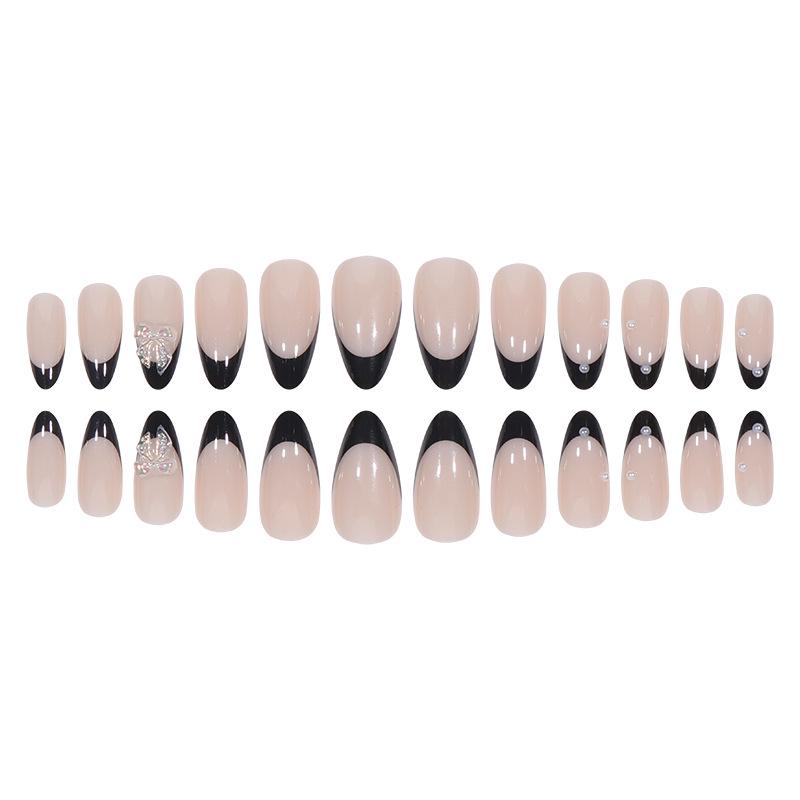 Removable Black French Rhinestone Butterfly Almond Nail Tips with Crushed Diamond Accents.