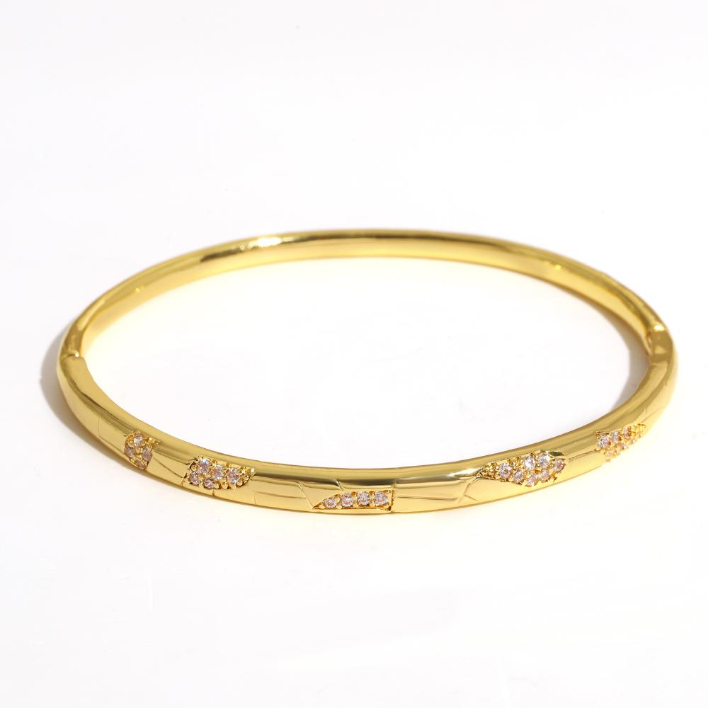 Luxuriöses funkelndes Strass-Armband, goldplattiert, für Damen, exquisites unregelmäßiges geometrisches Schleifenmanschetten-Federarmband Schmuck