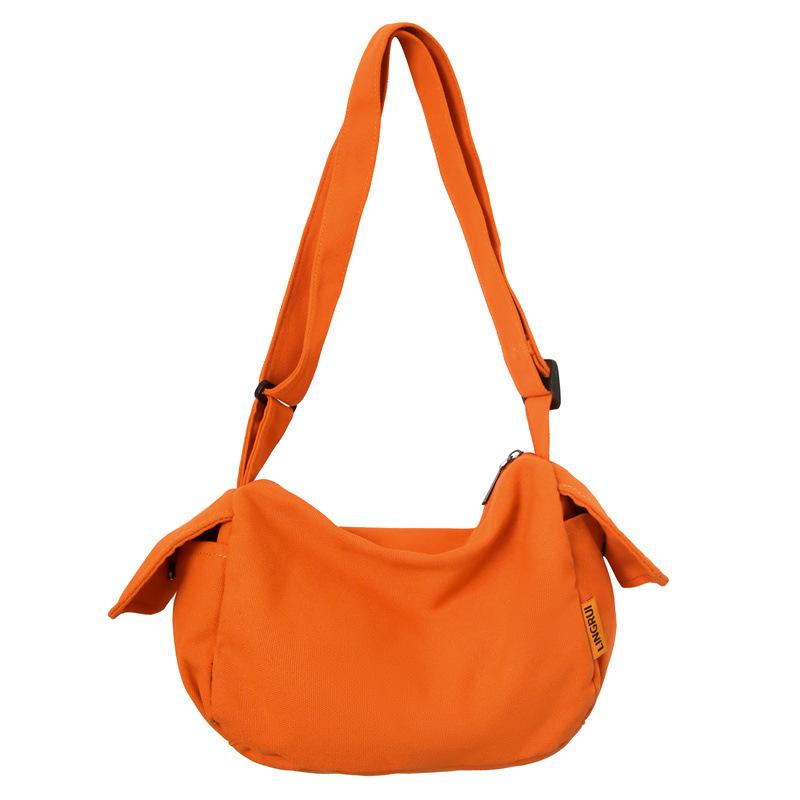 

Canvas bag women s new solid color casual shoulder bag large capacity trendy brand satchel student backpack mailman bag men оранжевый