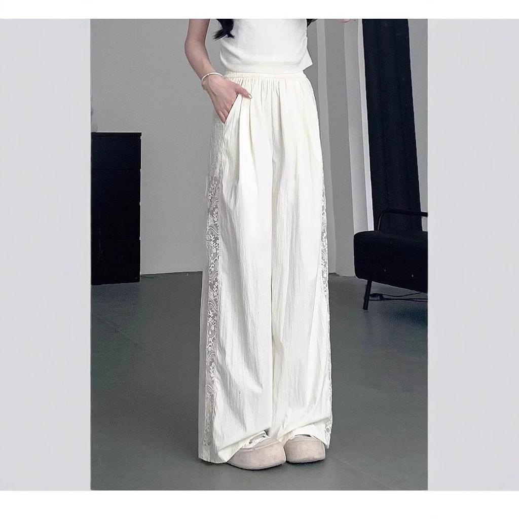Pantaloni a gamba larga traforati con inserti in pizzo da donna estivi a vita alta con senso del design larghi sottili drappeggiati casual