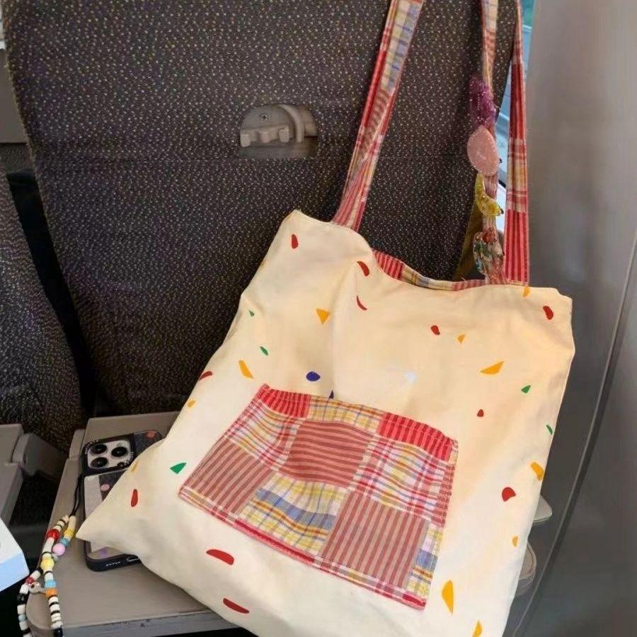 

Korean version ins literary and versatile canvas bag cartoon cute girl splicing plaid contrasting color shoulder tote bag
