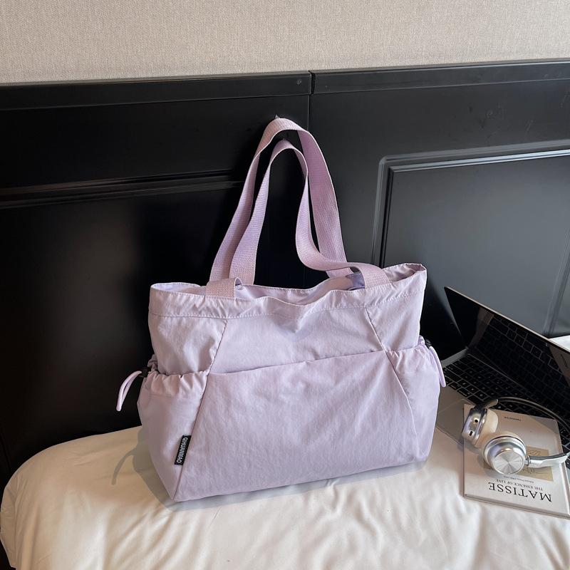 

2025 лето новый зарубежный стиль текстура простой большая вместимость сумка модный тренд повседневная женская на плечо сумка-тоут фиолетовый