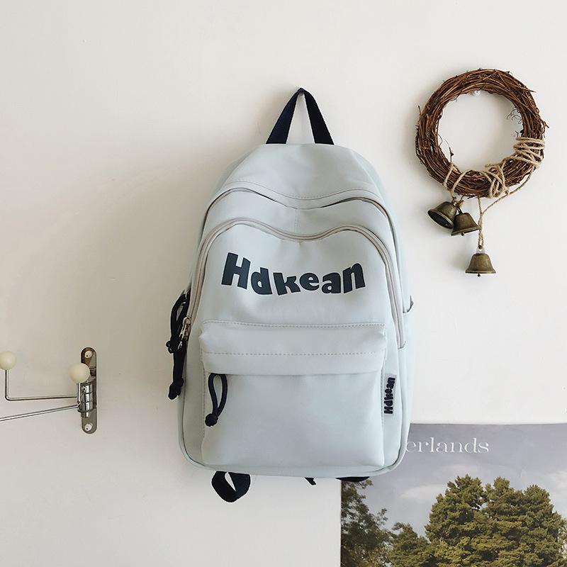 New High-value Solid Color Simple Letter Backpack Couple Casual Lightweight Large-capacity Backpack