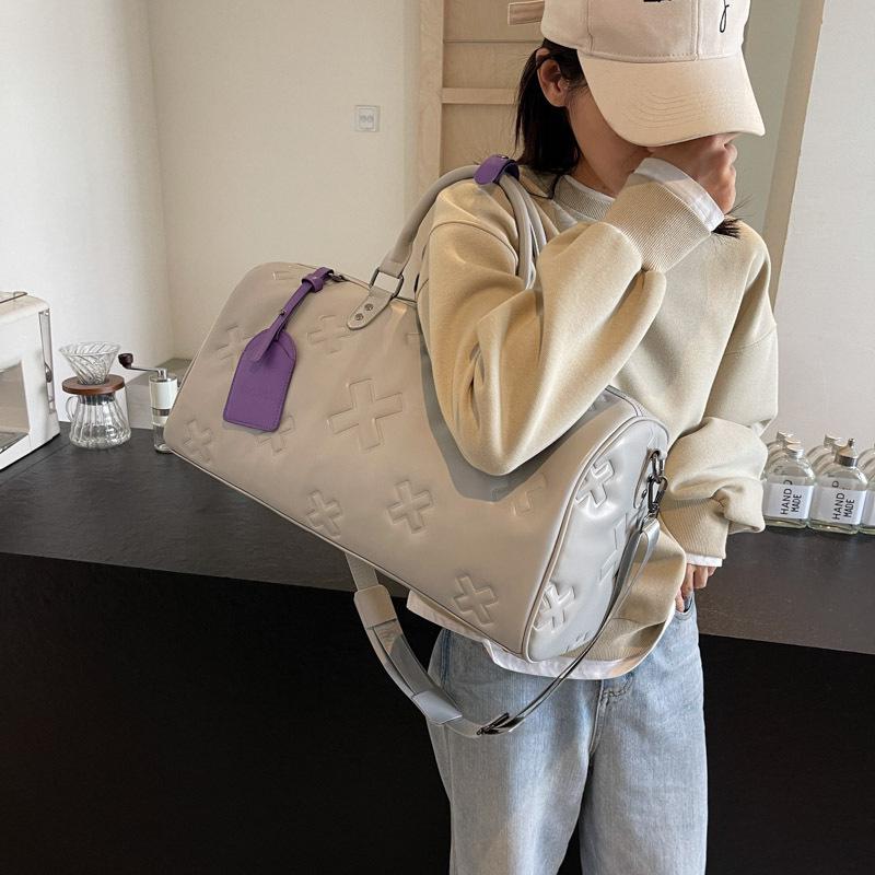 Fashionable PU Embossed Women's Handheld Travel Bag - Large Capacity Carry-on with Wet/Dry Separation for Business and Fitness.