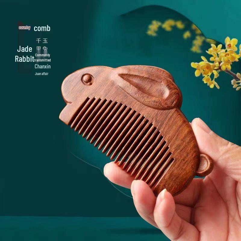 

Изысканный гребень из черного сандалового дерева с золотистым напылением в виде кролика с круглыми деревянными зубьями