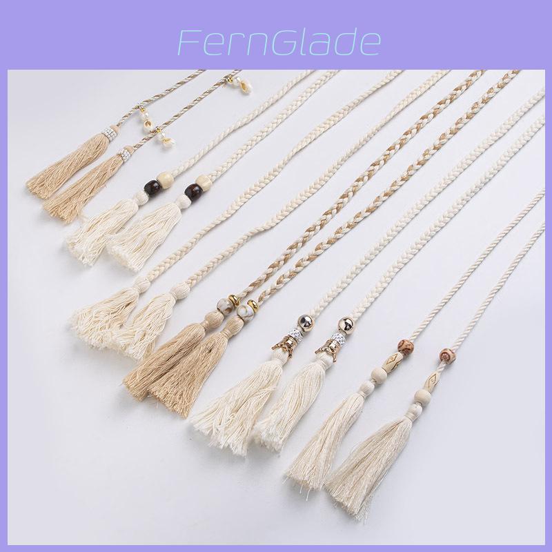 Cintura in corda di cotone stile boho con nappe a conchiglia per la moda bohémien dei festival.