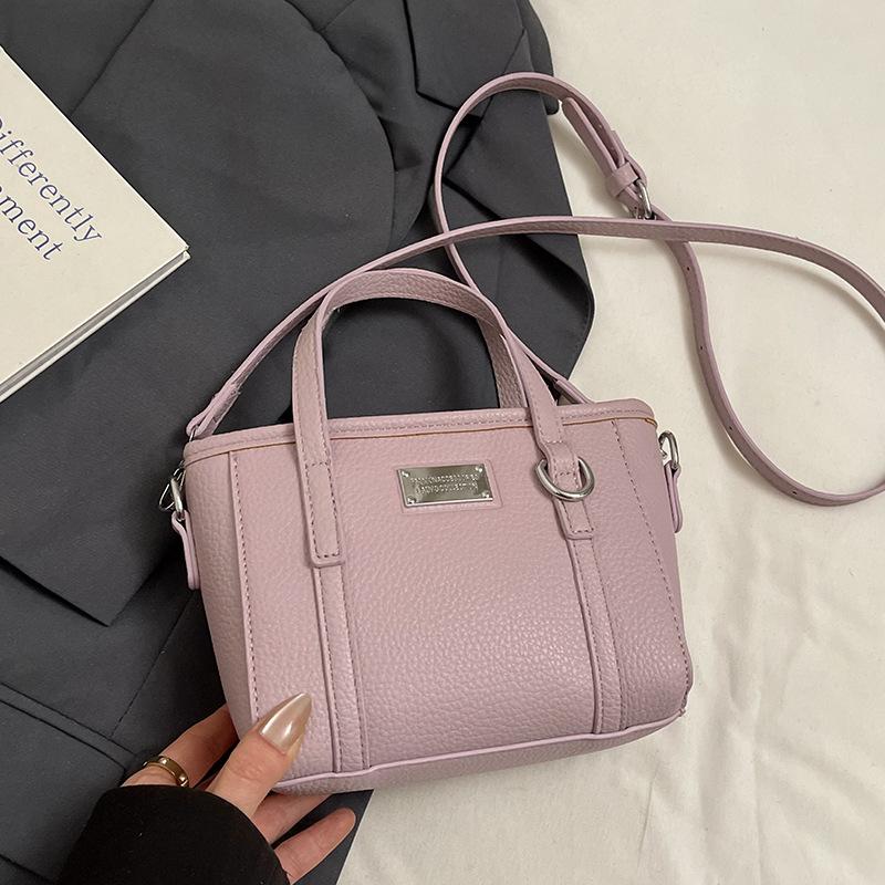 Spring hot sale lychee pattern high-end portable bucket bag Korean version casual small fresh temperament versatile messenger women's bag